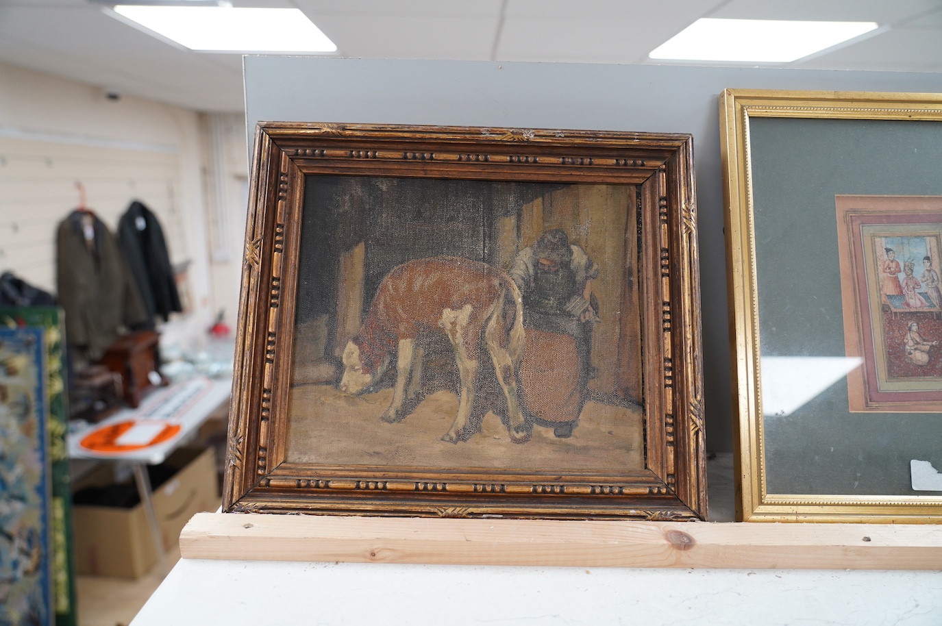 Late 19th century School, oil on board, Woman beside calf, 22 x 26cm. Condition - poor